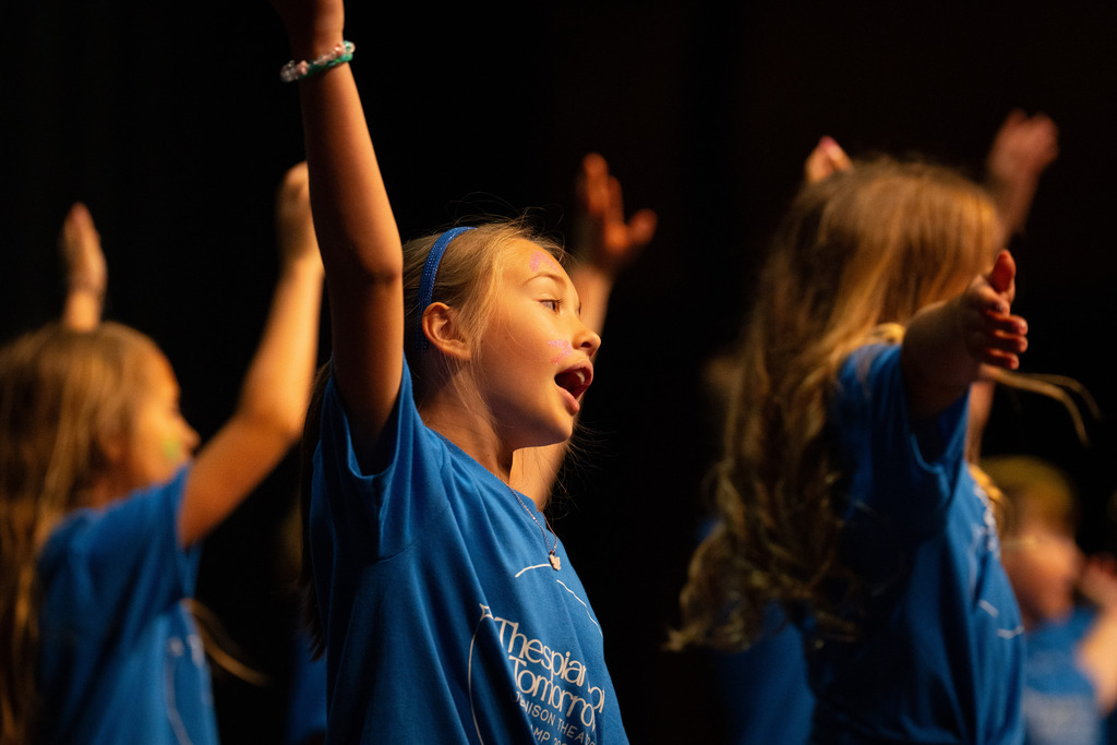 Student at theater camp singing