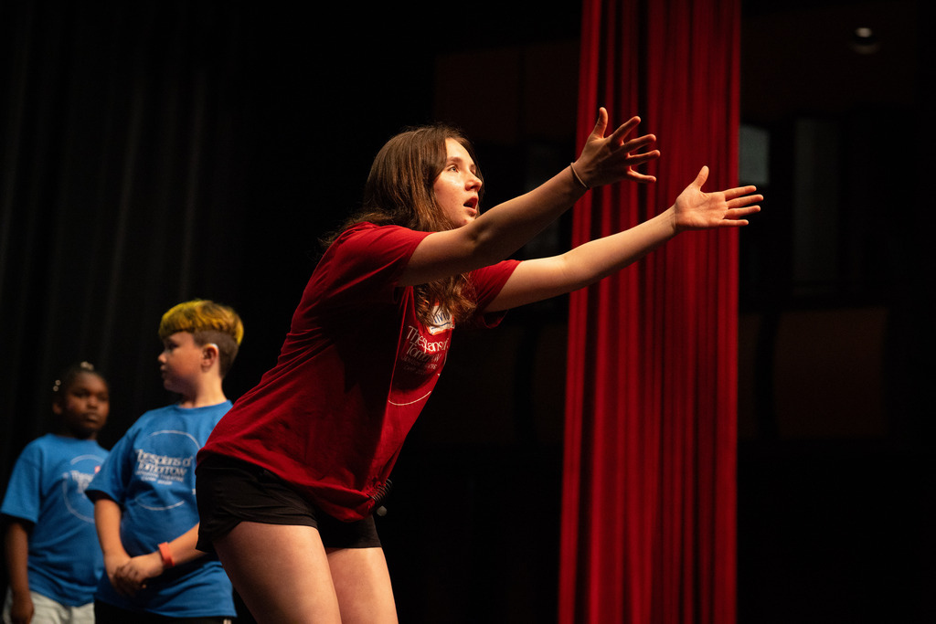 Student leader at theater camp teaching