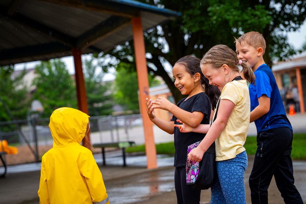 JIA students smiling on playground