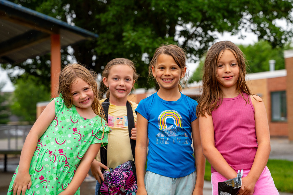 JIA students smiling on playground