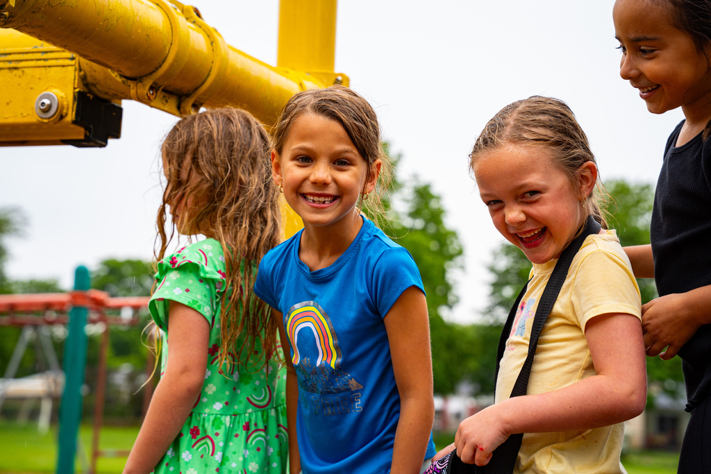 JIA students smiling on playground