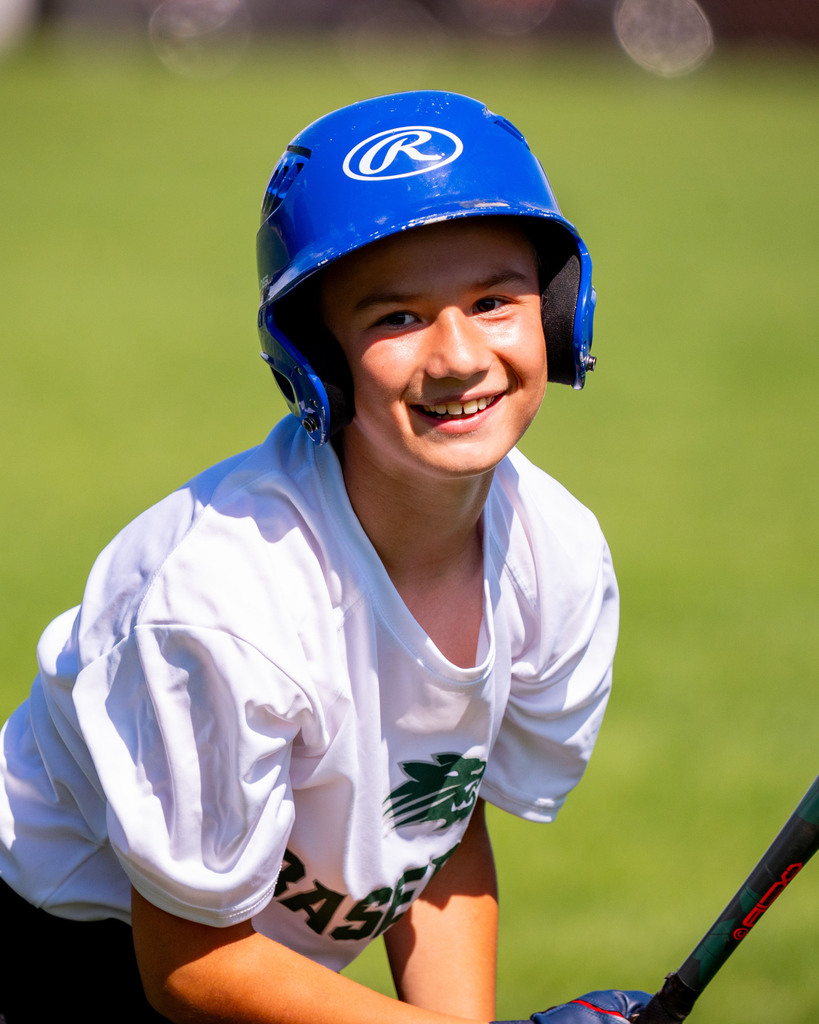 Jenison student at bat smiling