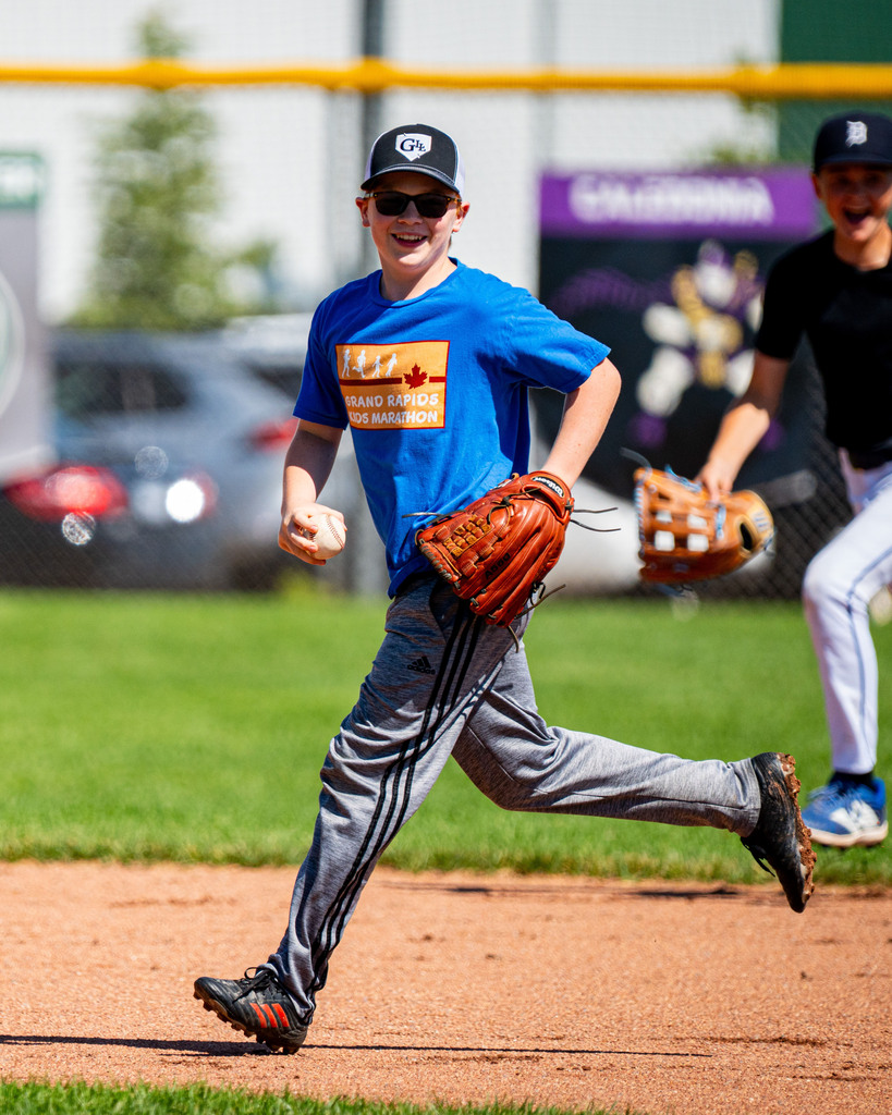 Jenison student running in the field