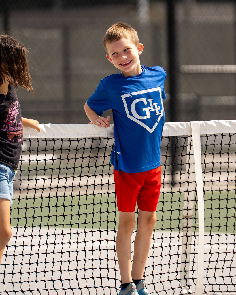 Jenison Tennis camp boy smiling