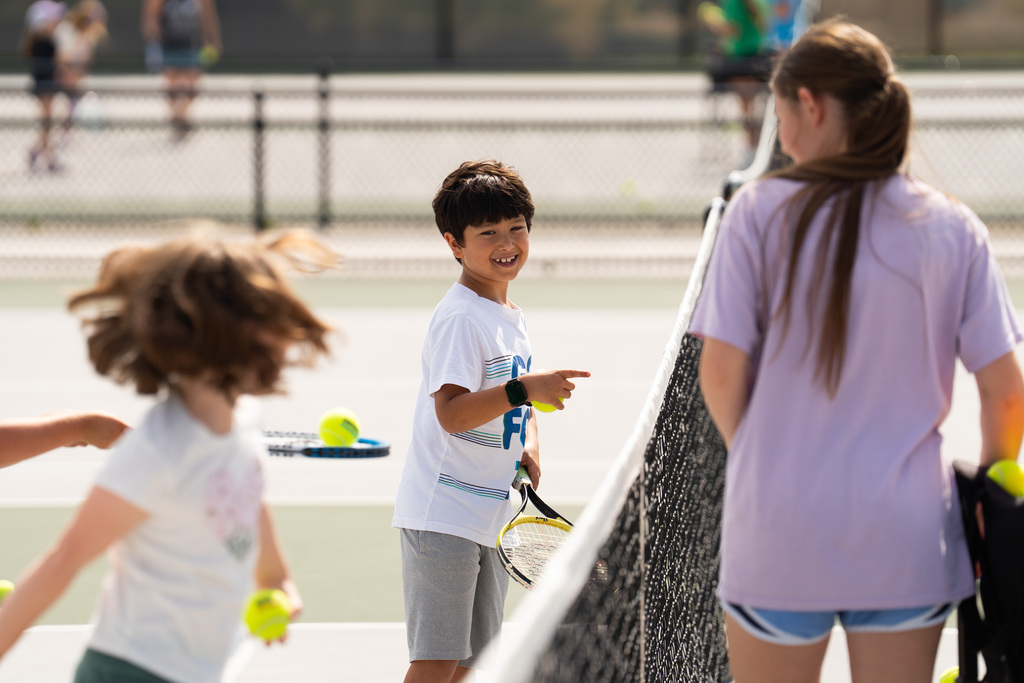 Jenison Tennis camp boy smiling
