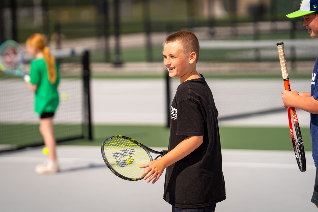 Jenison Tennis camp boy smiling