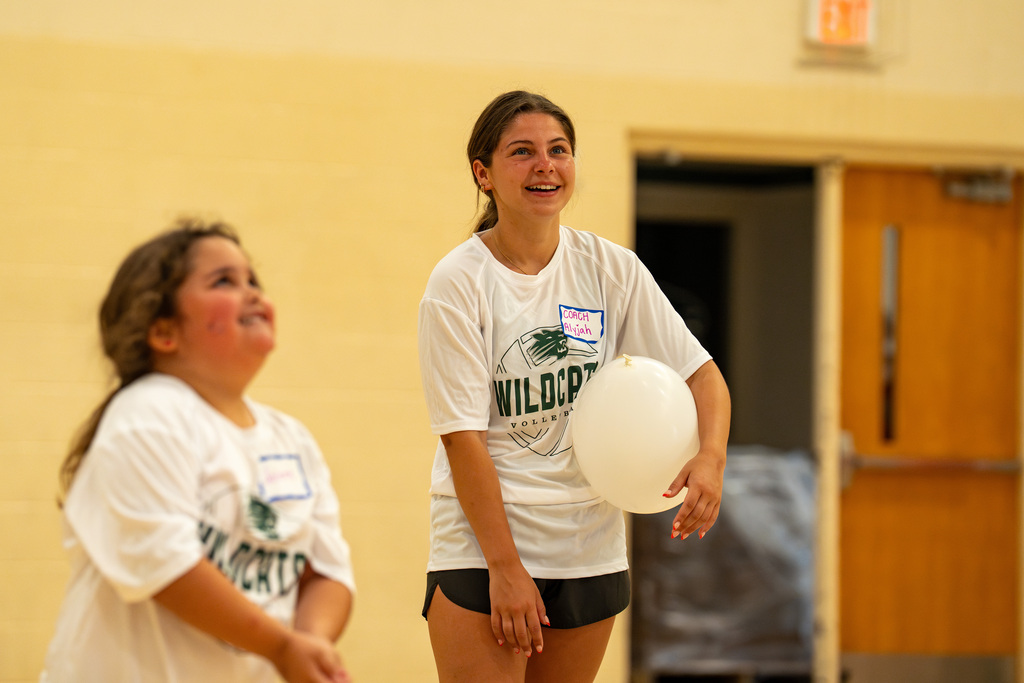 Volleyball student coach smiling
