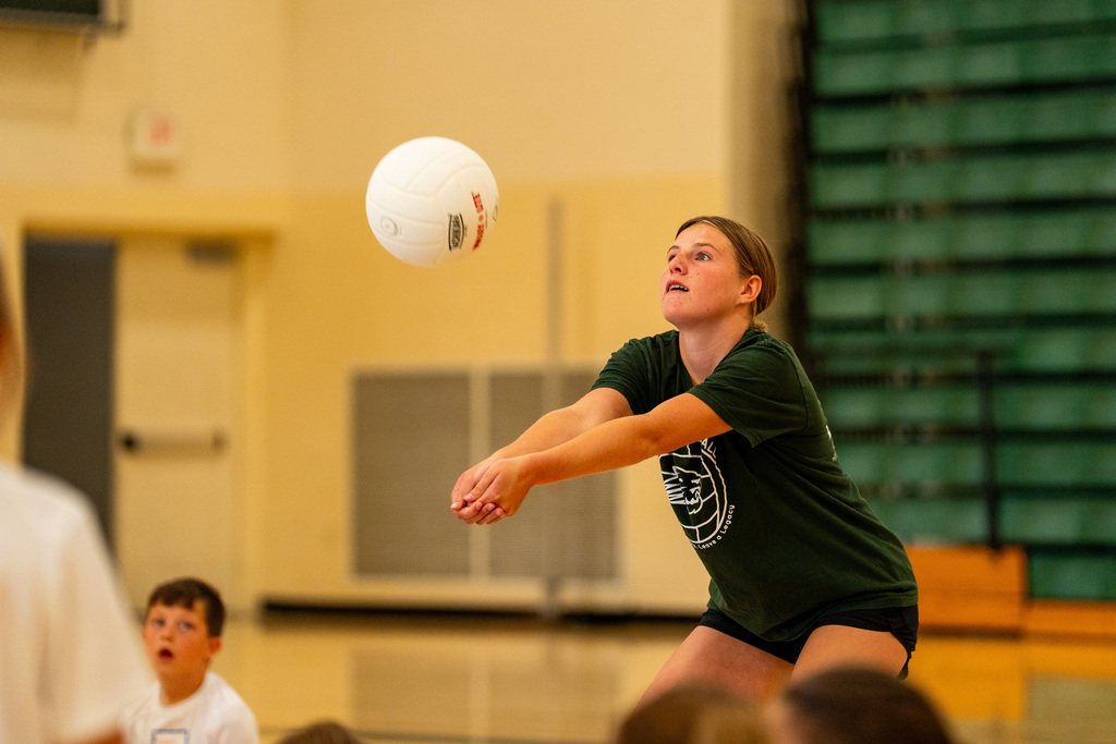 Volleyball student coach bumping the ball