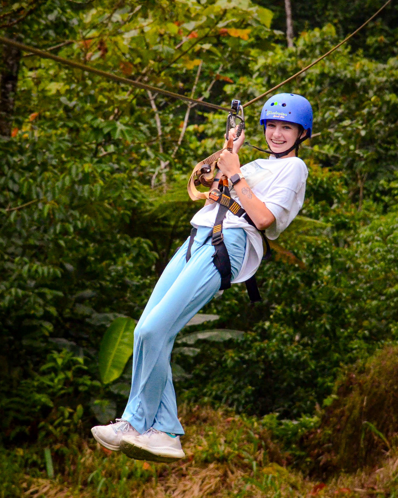 Junior high student smiles from zipline