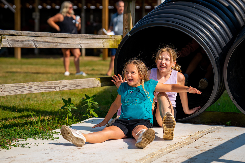 JIA students coming off slide