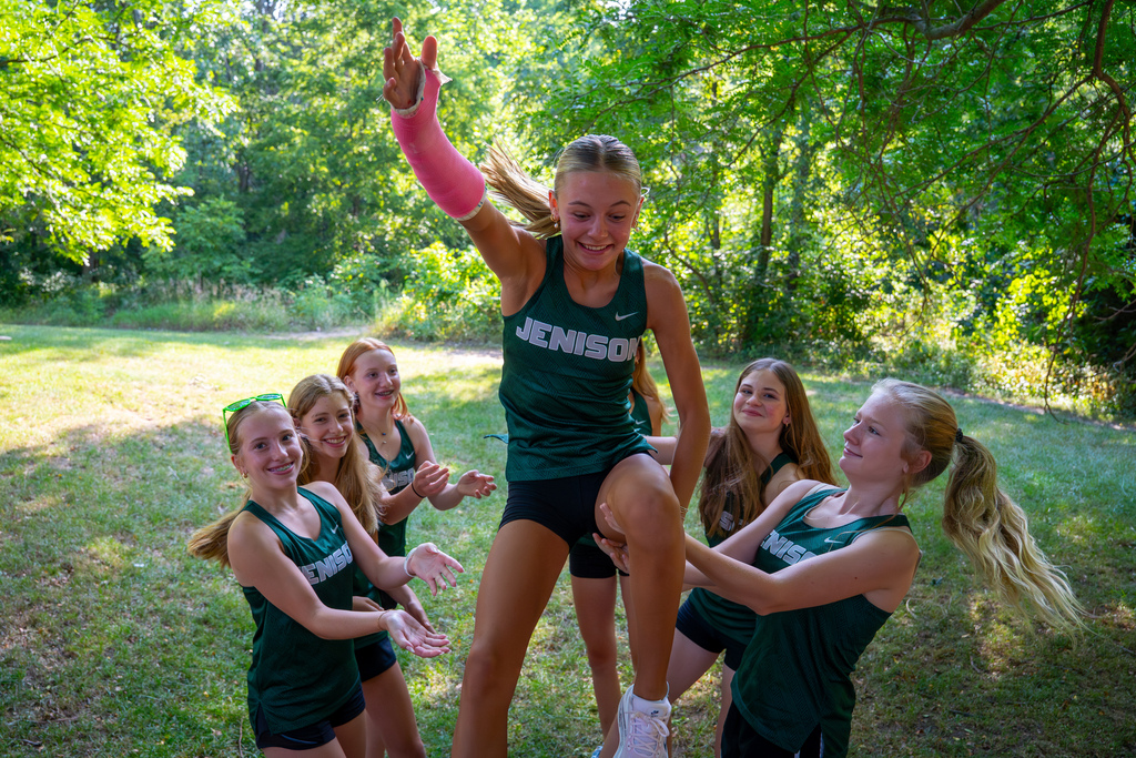 Girls cross country jumping