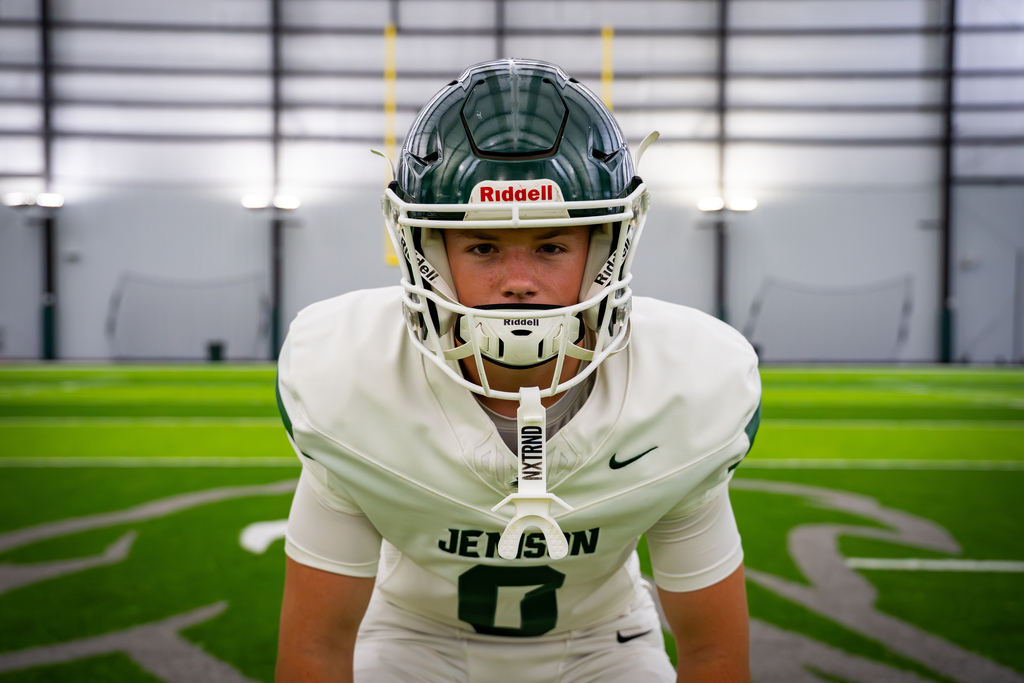 Football team member posing