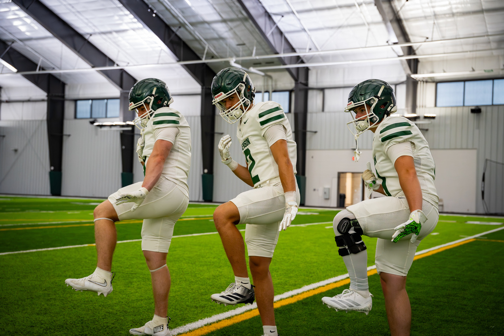 Football team members posing