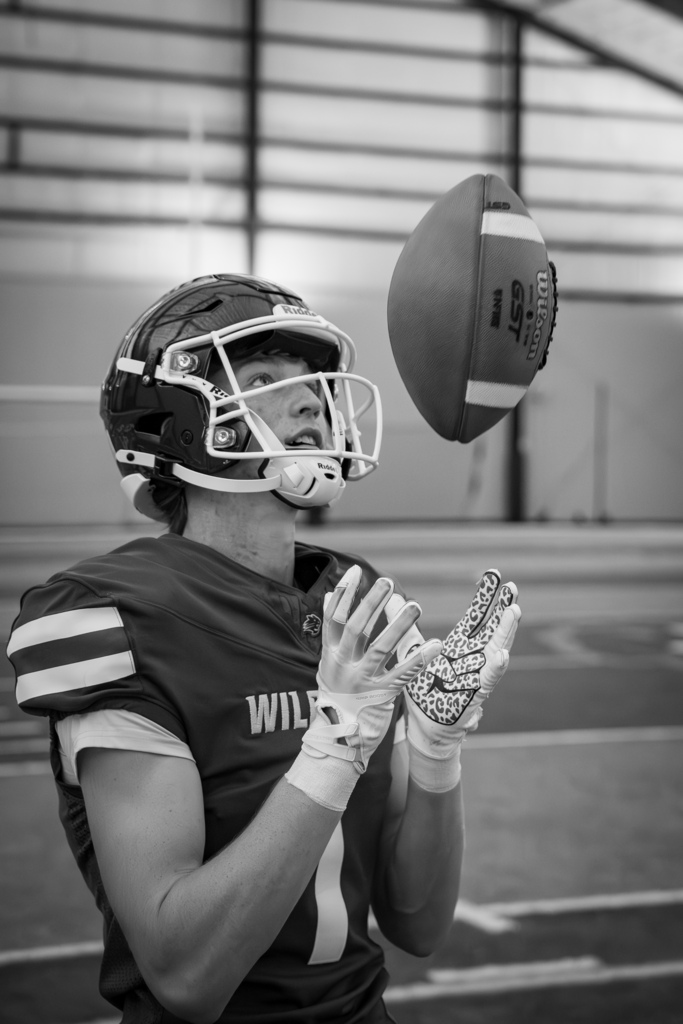Football team member catching ball