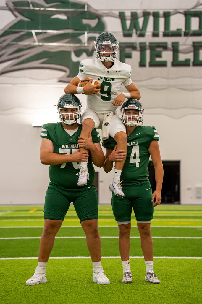 Football team members posing