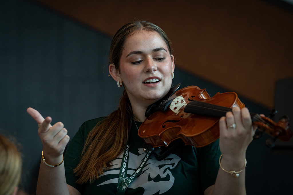 Orchestra director smiling