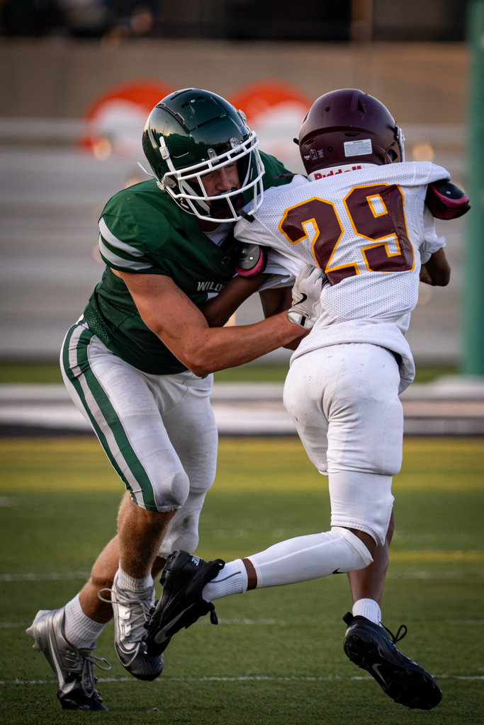 Wide receiver blocking cornerback