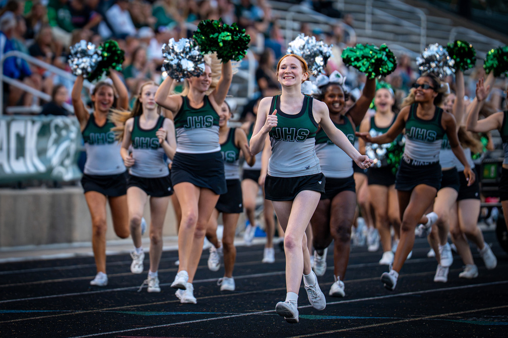 Cheer team celebrating a touchdown
