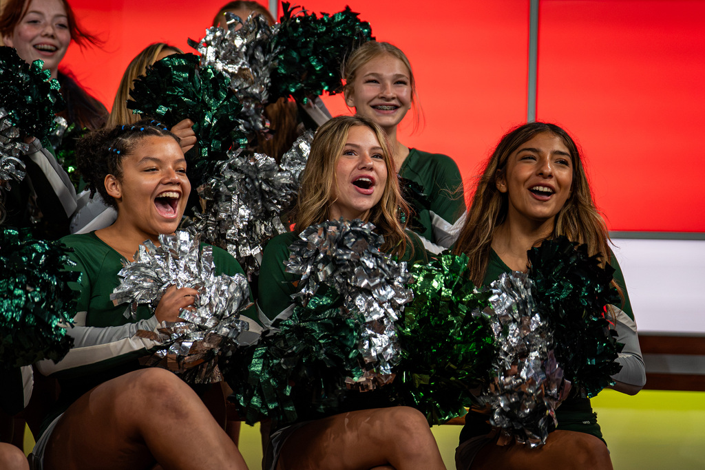 Cheerleaders cheering at TV studio