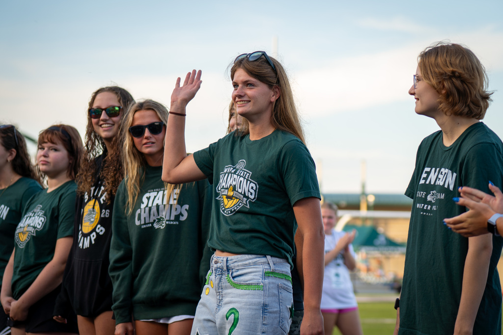 Girls water polo team waving during ceremony