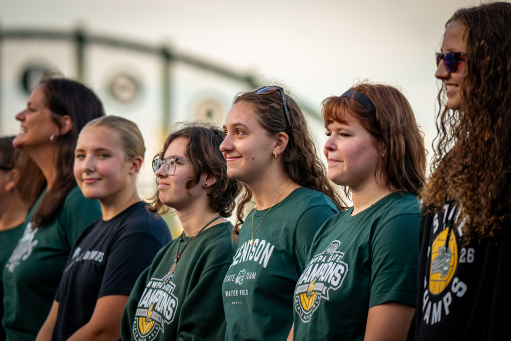 Girls water polo team smiling during ceremony