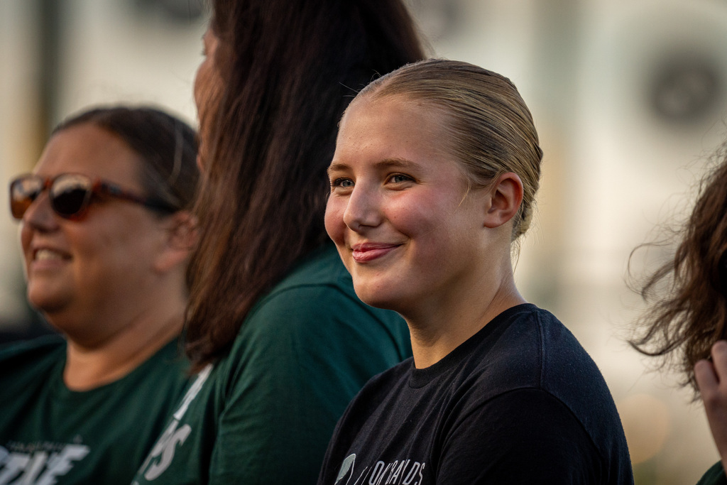 Girls water polo team smiling during ceremony