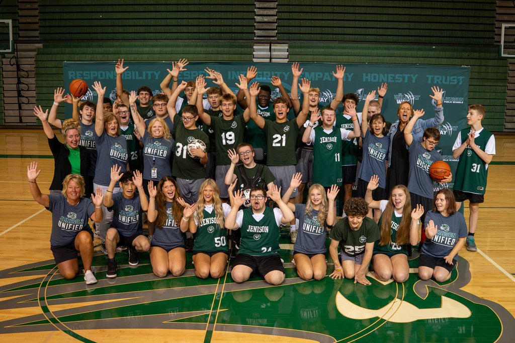 Unified athletes with hands in the air