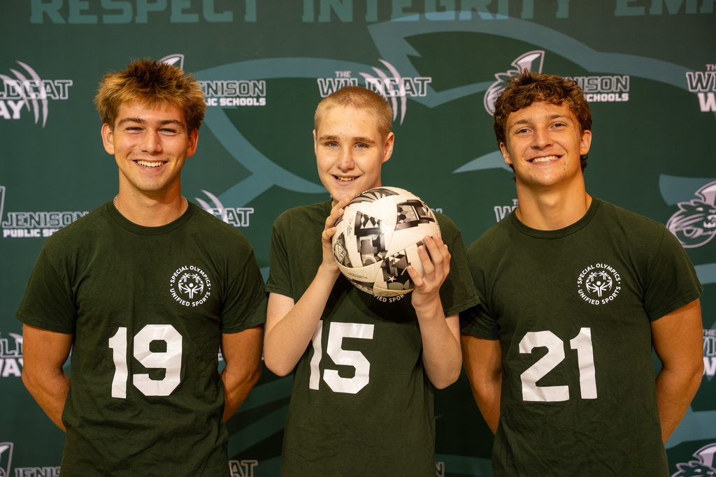 Unified athletes posing with soccer ball