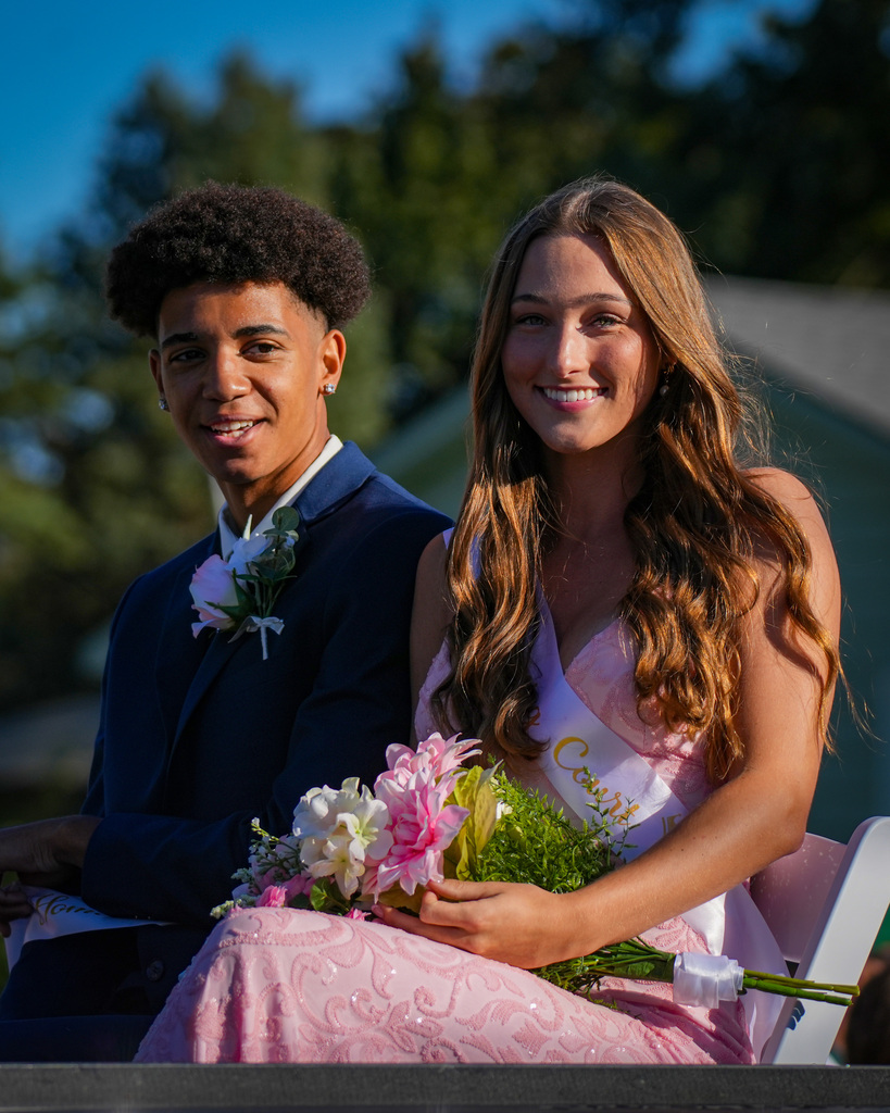 Homecoming reps smiling during parade