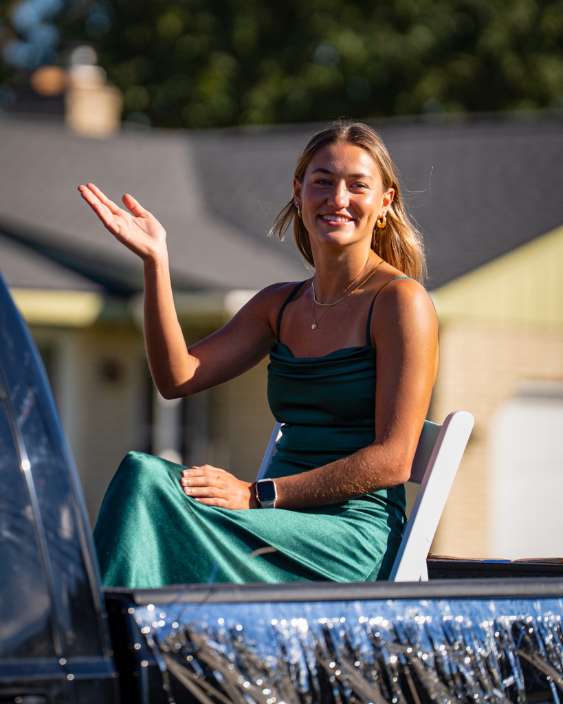 Last year's homecoming queen smiling