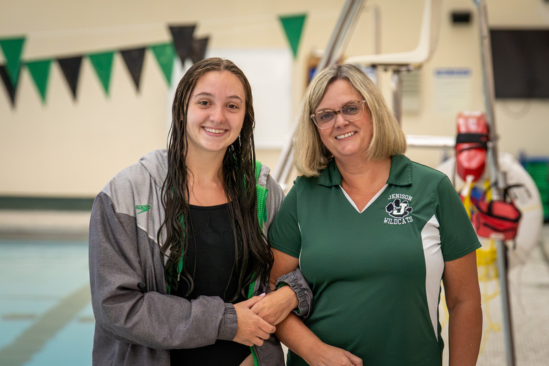 Swimmer and teacher posing