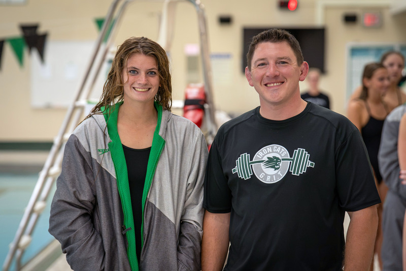 Swimmer and teacher posing
