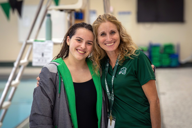 Swimmer and teacher posing