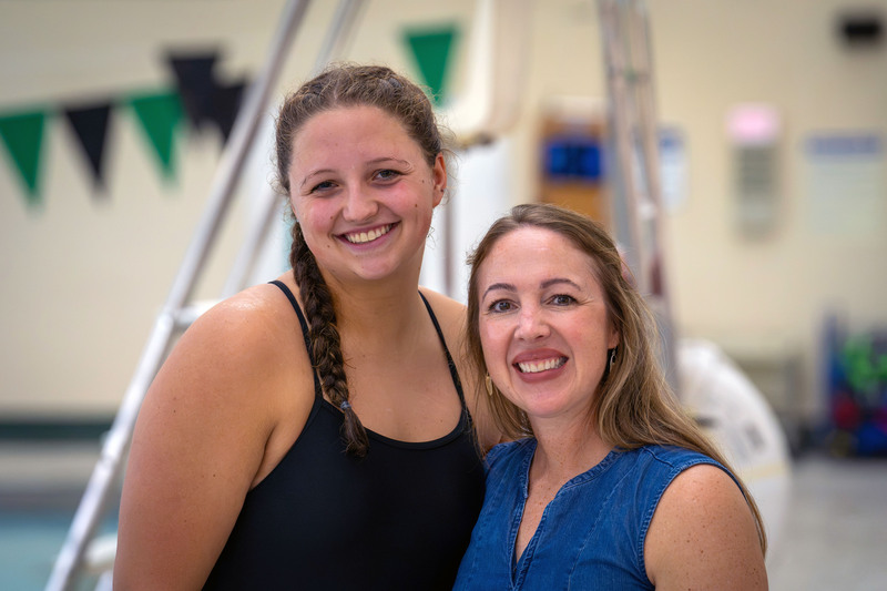 Swimmer and teacher posing