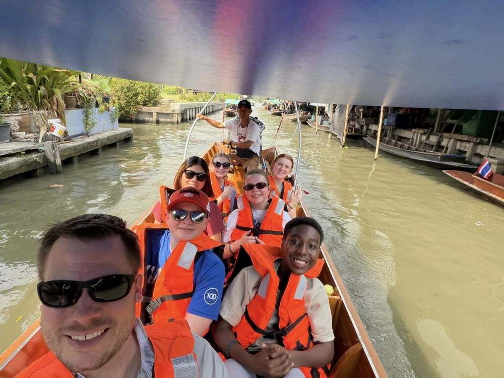teacher and student in a boat in Thailand