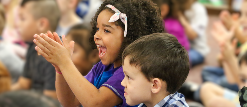 two prek kids smiling