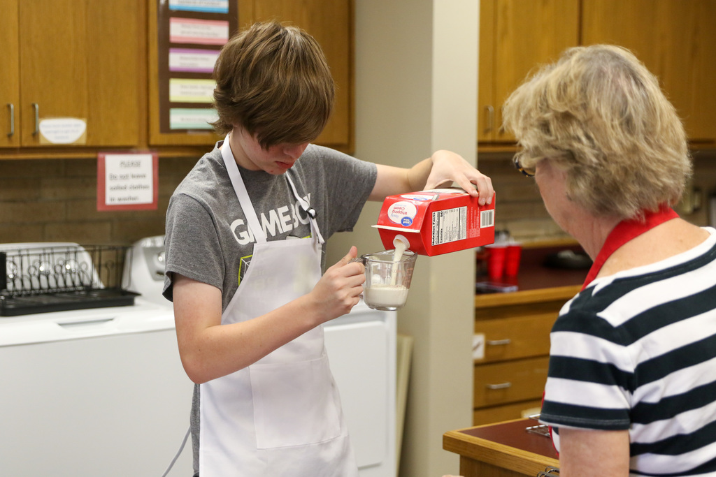 boy measuring heavy cream