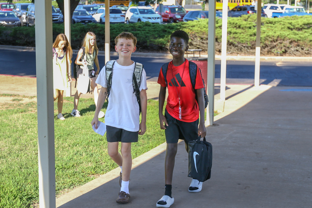 two boys walking into the middle school