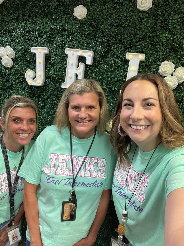 teachers with backdrop