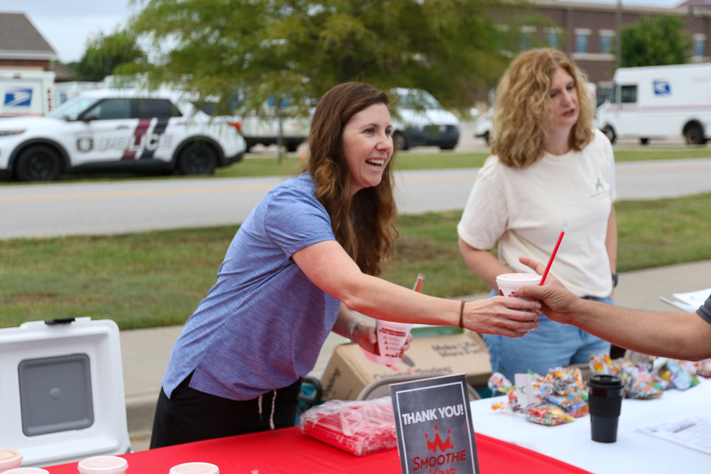community partner hading out smoothies