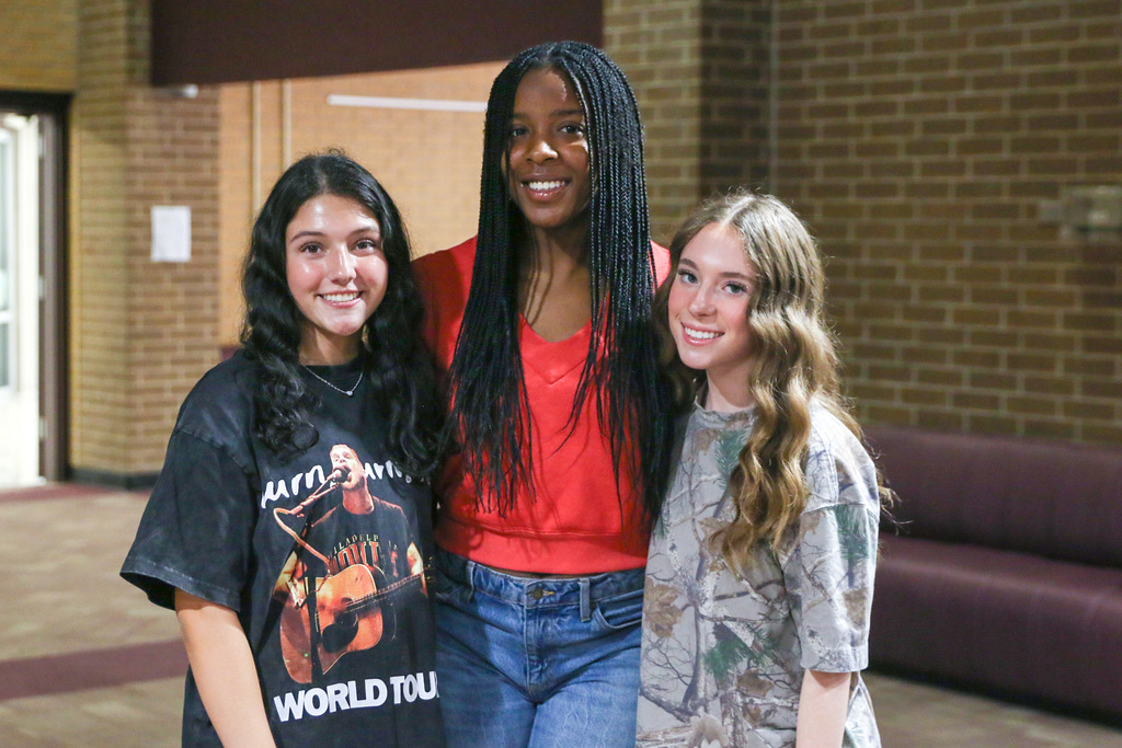 three AVID students smiling for photo