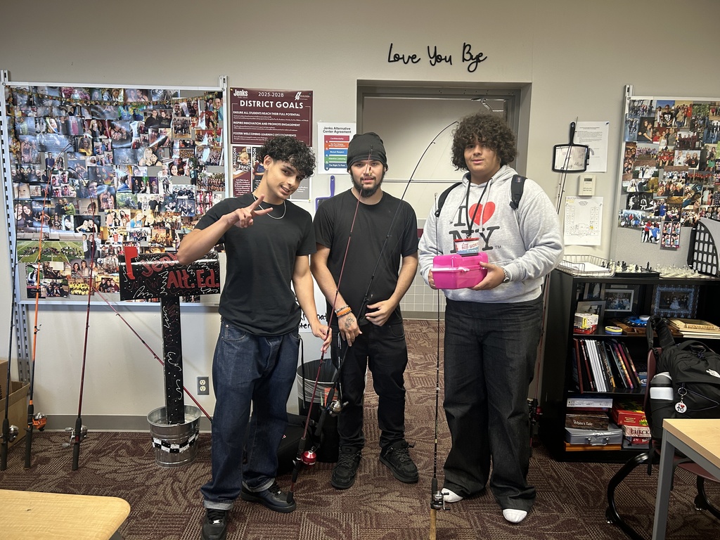 three students with fishing gear