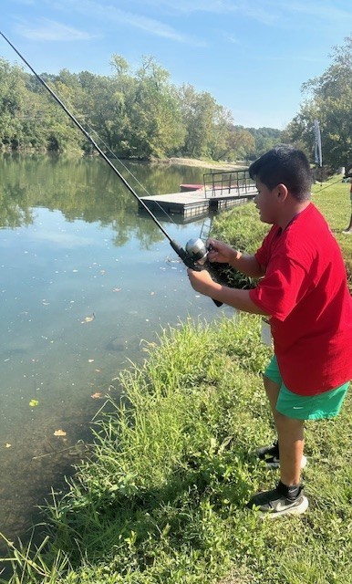 student fishing at Jenks Wild