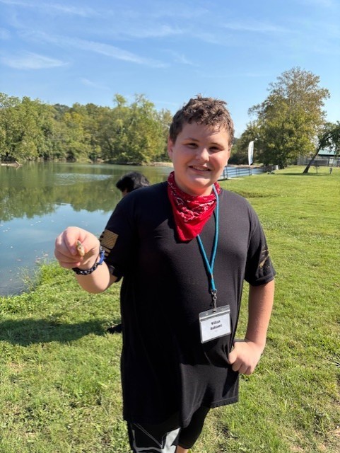 student fishing at Jenks Wild