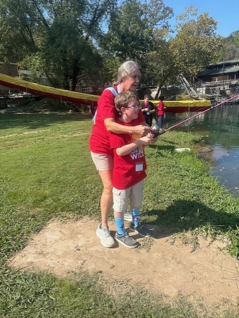 student and teacher fishing at Jenks Wild