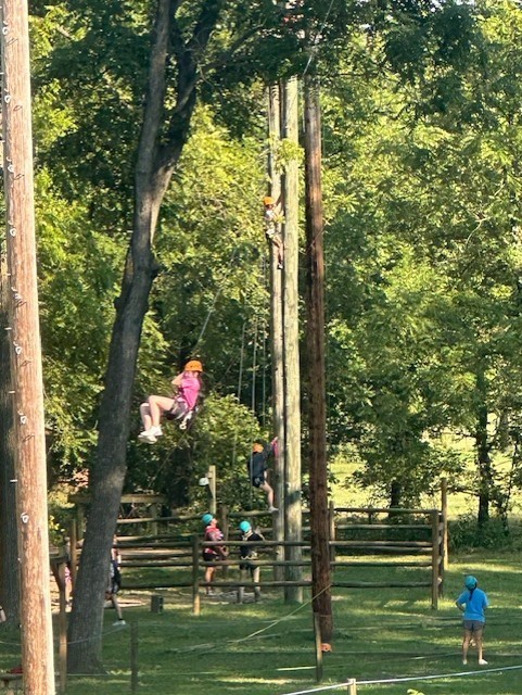 students zip lining at Jenks Wild