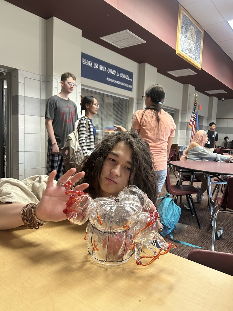 A student with a glass sculpture 