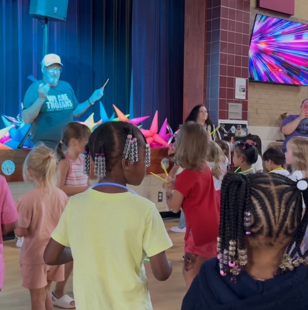 Principal at dance a thon dancing with students.