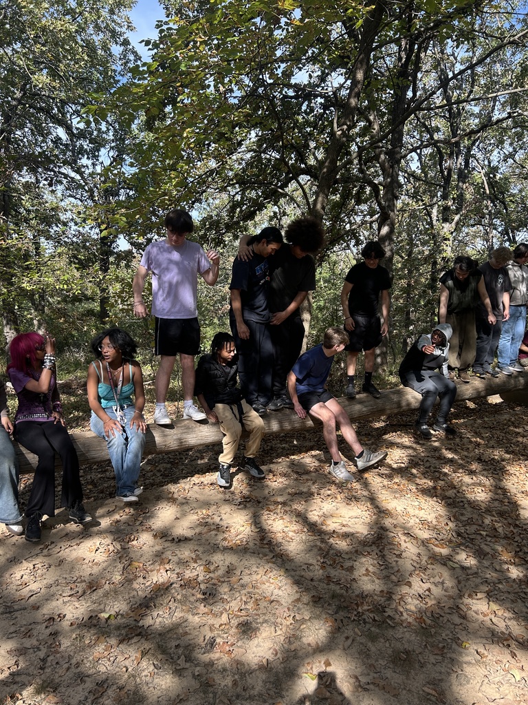 students on a log