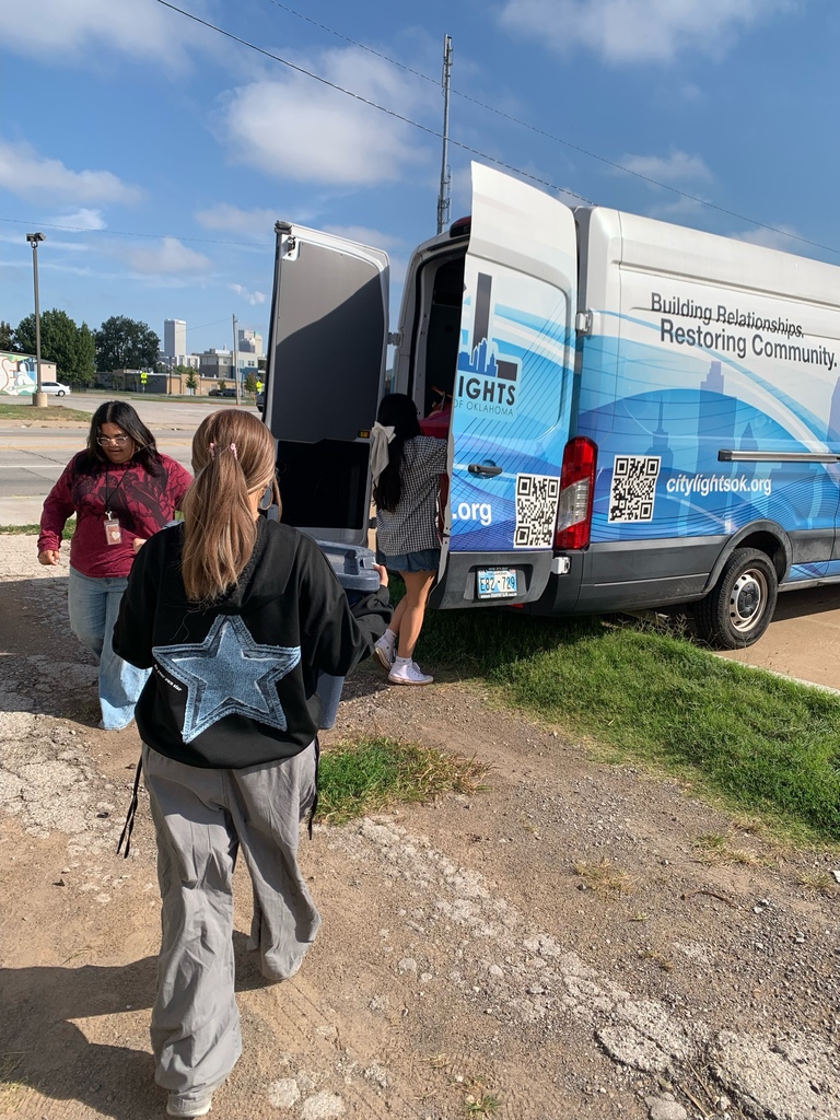 students unloading truck